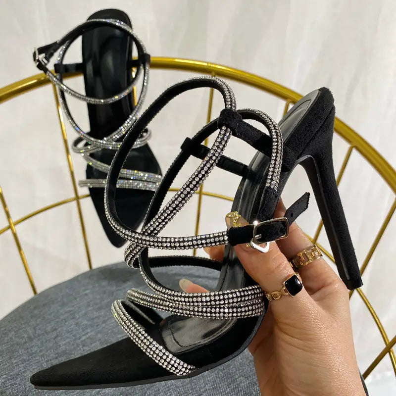 Stylish black strappy stiletto heel sandals with rhinestones for ladies pointed toe look.