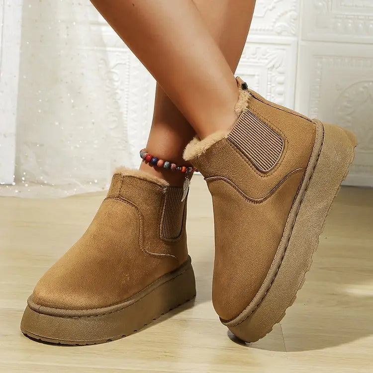 Tan suede ankle boots with elastic side panels for a casual Ugg style look.