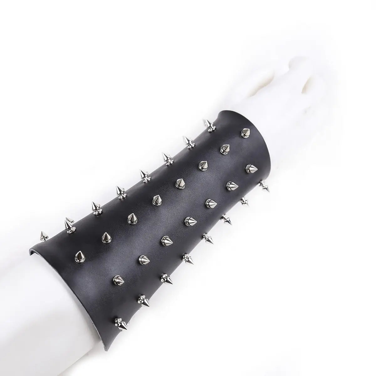 Black leather spiked gauntlet with studs for erotic bondage straps and nail bondage armor.