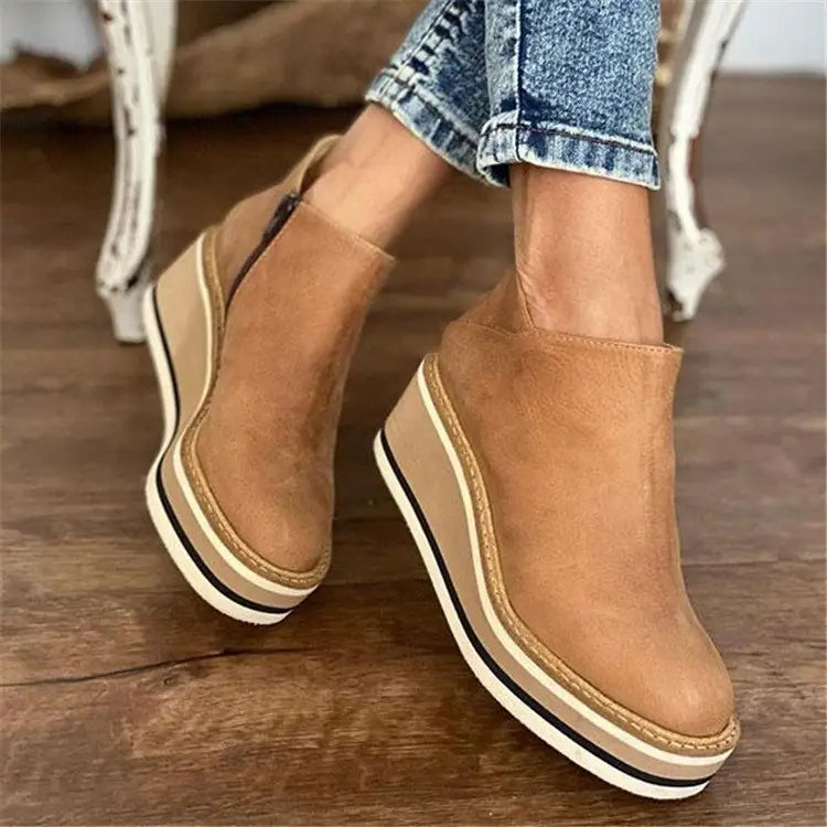 Tan suede ankle boots with white platform soles and gold trim, perfect zipper mid heel style.