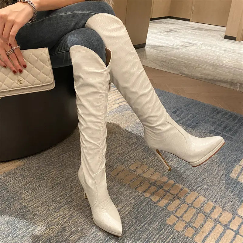 White and Black Leather Knee High Stiletto Boots for Women with pointed toe and stiletto high leg.