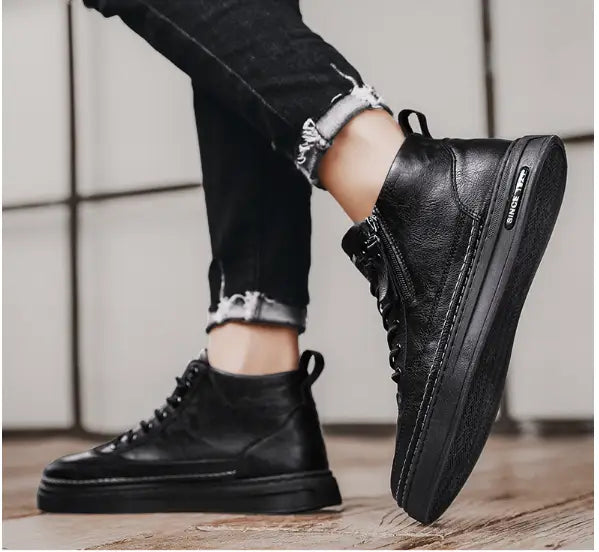 Black leather high-top sneakers for mens high casual shoes with a trendy, versatile style.