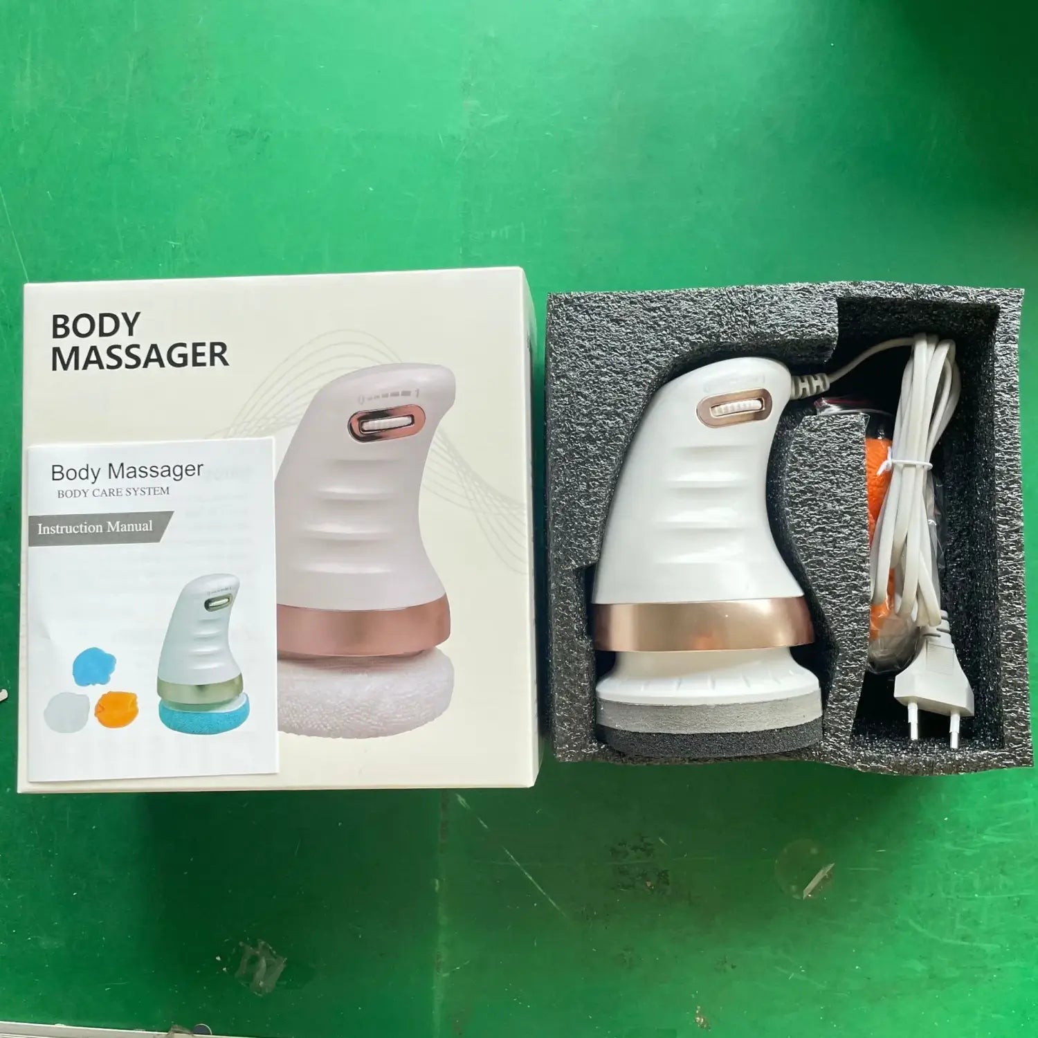 Electric ladies body sculpting massager in sleek white and rose gold design.