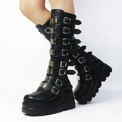 Tall black platform boots with multiple buckle straps running up the shaft.