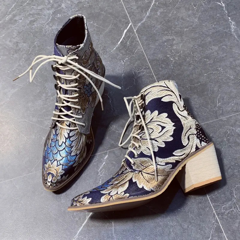 Lace-up ladies satin embroidered high heel pointed ankle boots in blue and silver floral brocade.