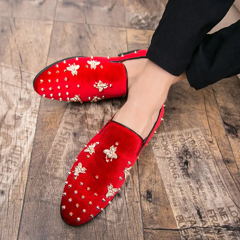 Red velvet loafers with bee encrusted metallic embroidery and studs for stylish men.