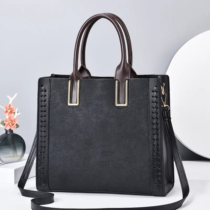 Stylish black structured handbag with brown handles, perfect for a Bright Yellow Luxury Elegant Shoulder Bag.