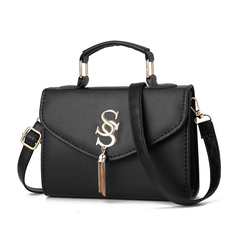 Black leather handbag with gold tassel and metal handle for stylish fashion shoulder messenger.