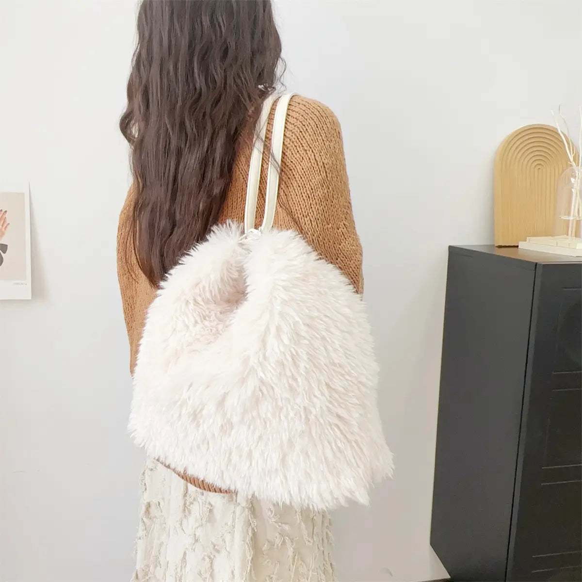 Fluffy white faux fur shoulder bag, perfect plush large capacity accessory for stylish days.