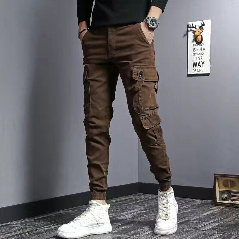 Brown Slim Fit Elastic Cargo Trousers featuring multiple pockets and elastic cuffs.