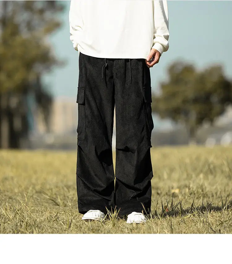 Black corduroy cargo pants with pockets and loose fit for laid-back style.