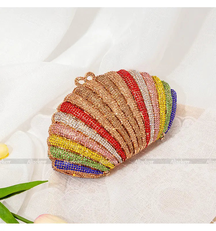 Rainbow shell rhinestone clutch purse with colorful stripes and beaded details.