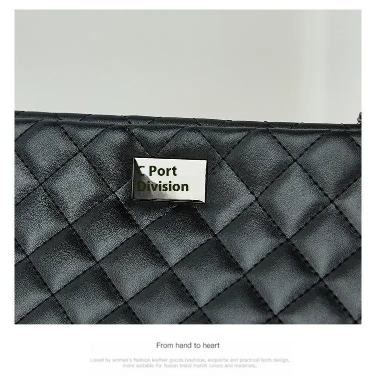 Black quilted leather bag with Port Division nameplate and shimmering chain strap.