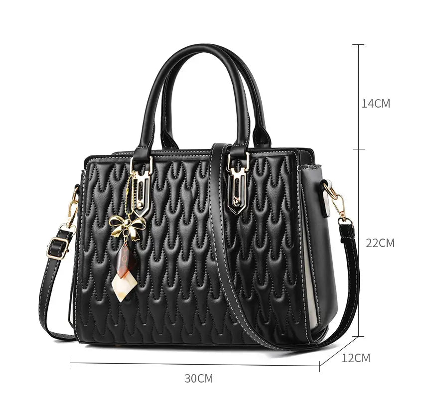 Black quilted handbag with charms, perfect for a high capacity fashion handbag vibe.