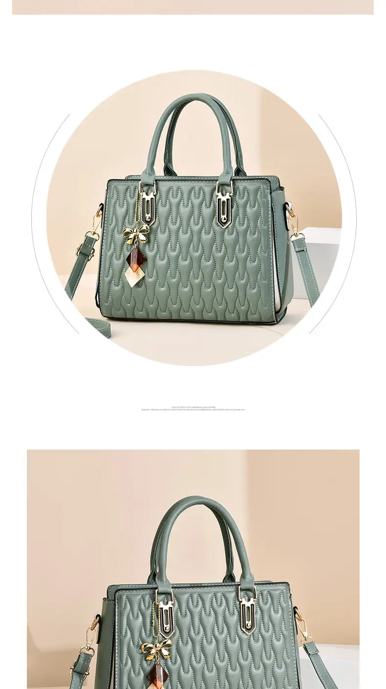 Mint green textured handbag with tassels and gold hardware, perfect for a high capacity fashion handbag.