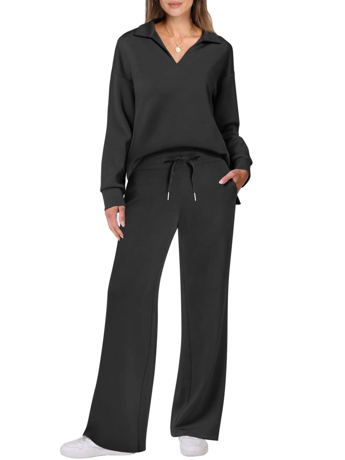 Black knit ladies two piece casual outfit set with half-zip pullover and wide-leg pants.