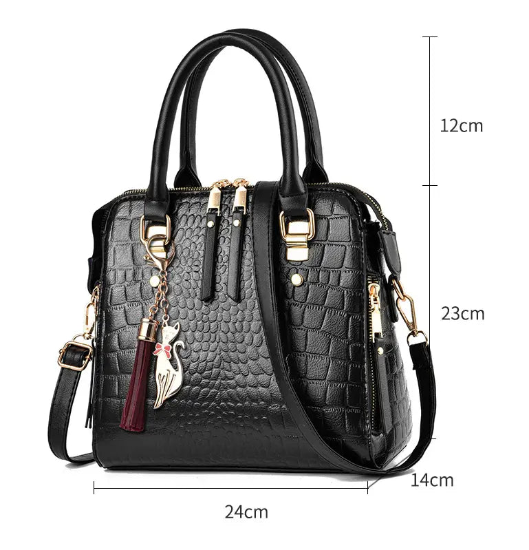 Stylish Ladies Crocodile Print Crossbody Shoulder Bag with gold hardware and tassel.