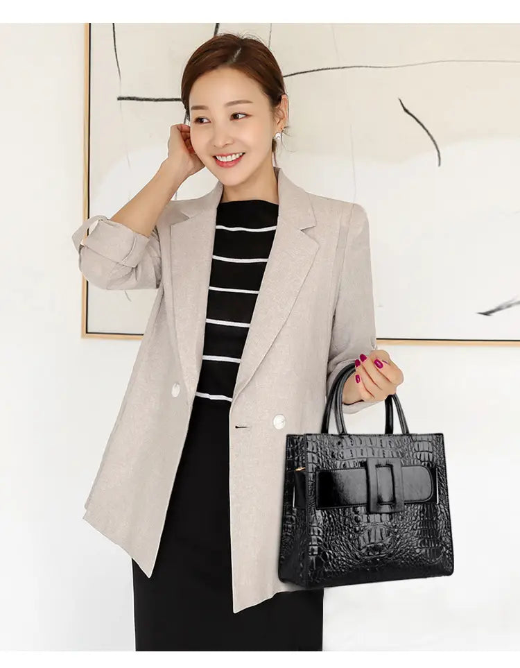 Womens Crocodile Shoulder Crossbody Tote Bag with Buckle Detail in black leather.