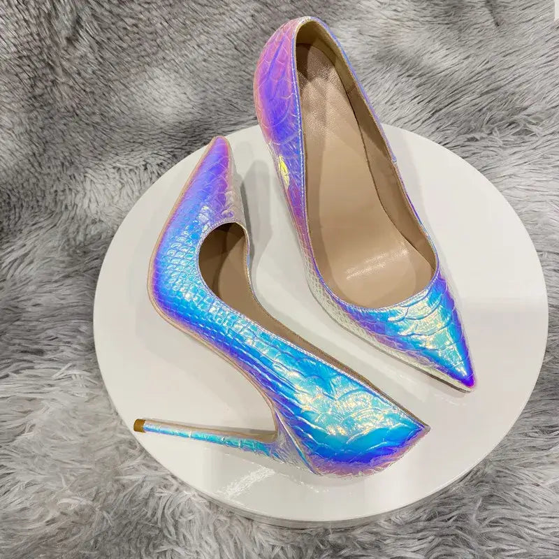 Iridescent holographic stiletto high heels featuring silver crocodile effect and pointy toe.