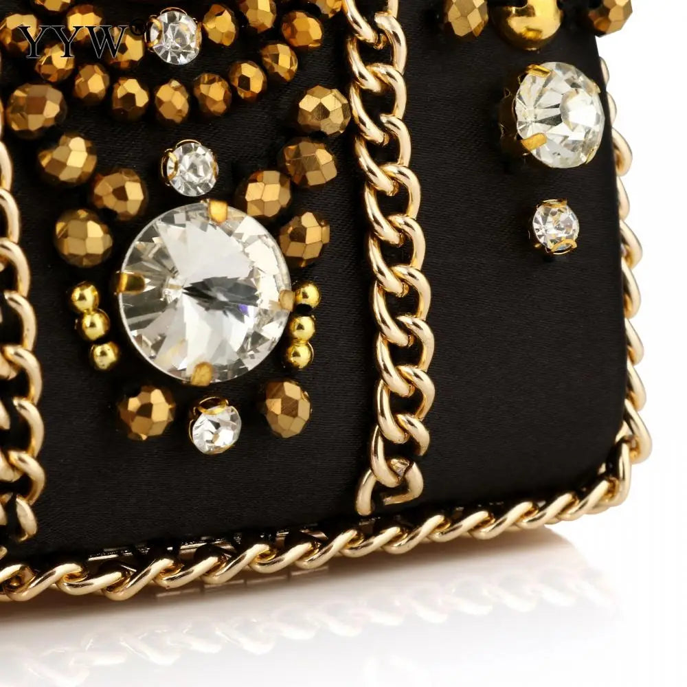 Black Satin Bohemia Style clutch with gold chains, studs, and crystal details.