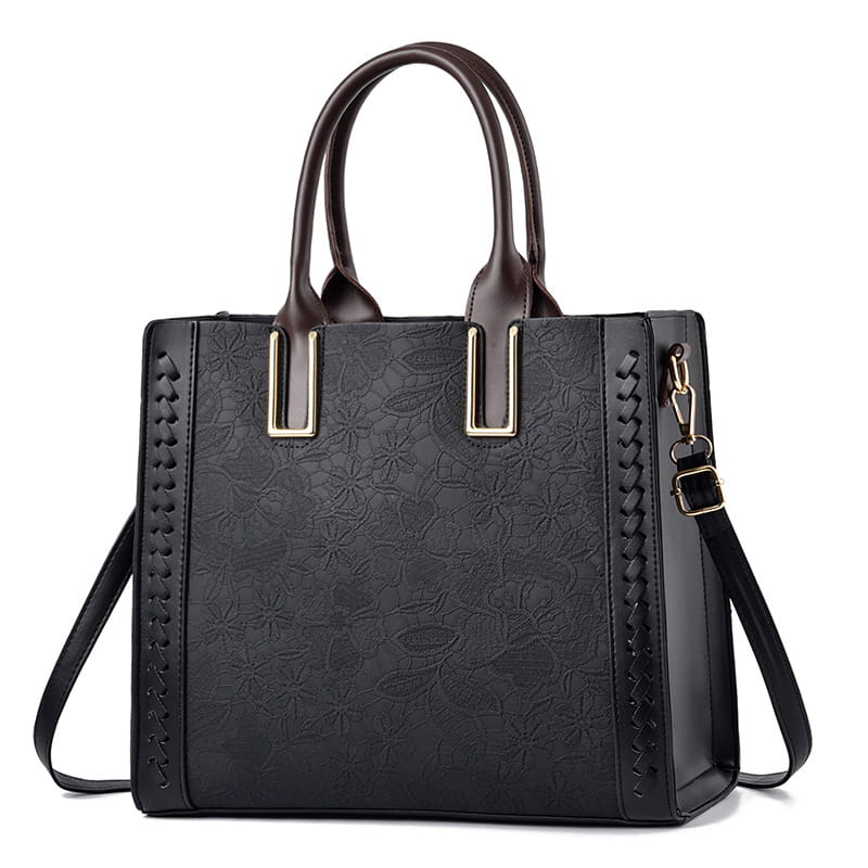 Black structured handbag with embossed pattern perfect for a bright yellow luxury elegant shoulder bag