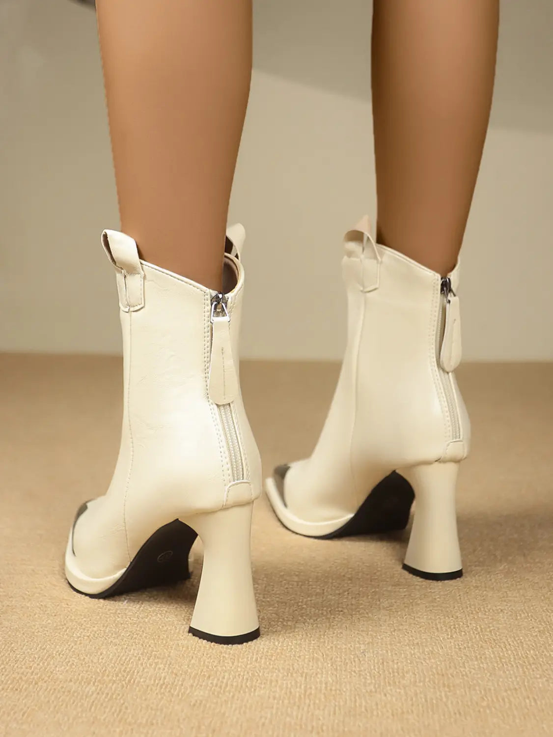 White leather ankle boots with chunky heels and side zippers for stylish retro mid-calf vibes