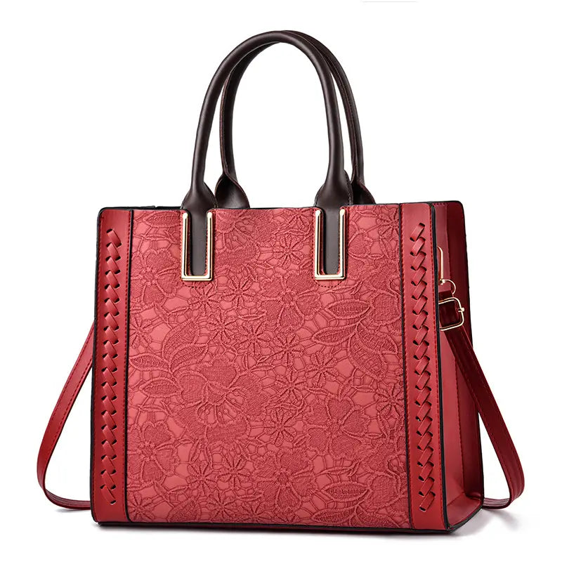 Red floral-embossed handbag with dark handles perfect for a Bright Yellow Luxury Elegant Shoulder.