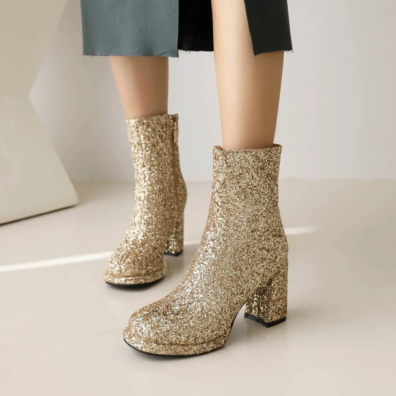 Gold Glitter Thick High Heel Ankle Christmas Boots for ladies with chunky heels.