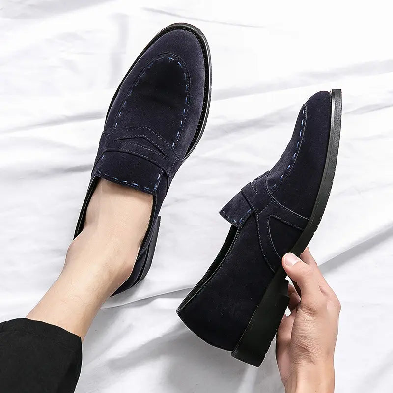 Black suede pointed toe casual loafers showcasing stylish stitching details.