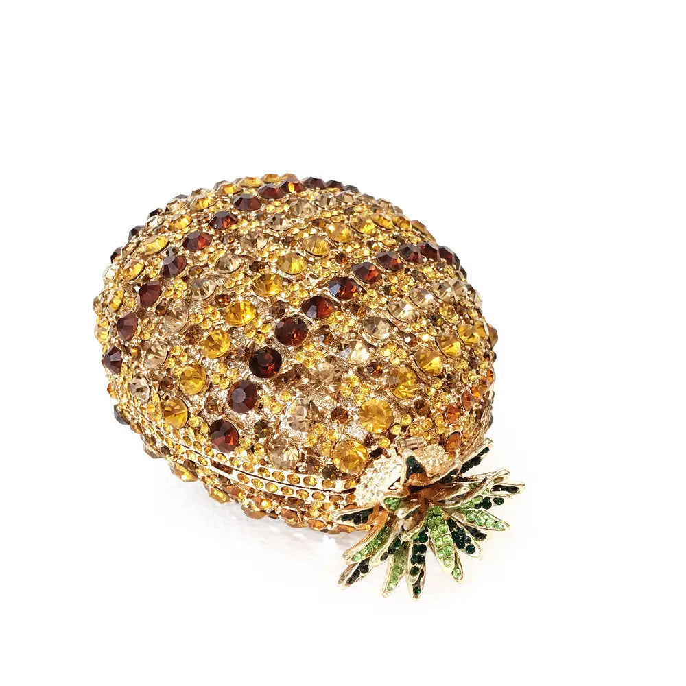 Decorative pineapple shaped crystal brooch with amber crystals for a diamante banquet bag.