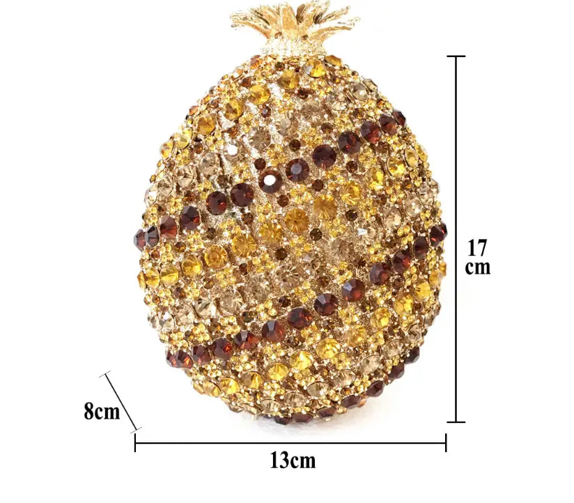 Pineapple shaped crystal ornament with gold and brown rhinestones on a diamante banquet bag