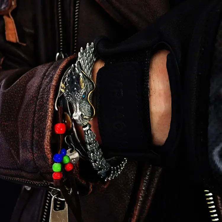 Metallic dragon zipper pull with colorful beads on a silver plated mens retro bracelet.