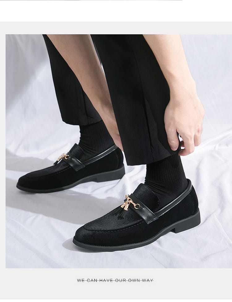 Black suede loafers with gold hardware styled with dark socks for Men’s British Style Velour Moccasin.