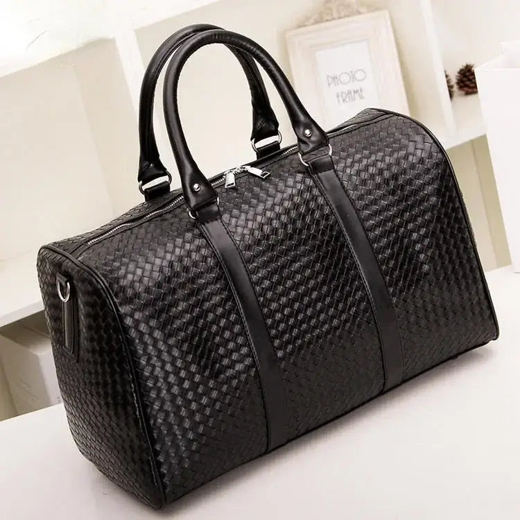 Stylish Black Woven Leather Duffle Bag, perfect unisex luggage for business trip carry.