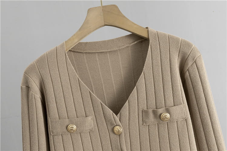 Beige ribbed cardigan with buttons and pockets from a Chanel Style Wide Leg Three-piece Knitted Set.