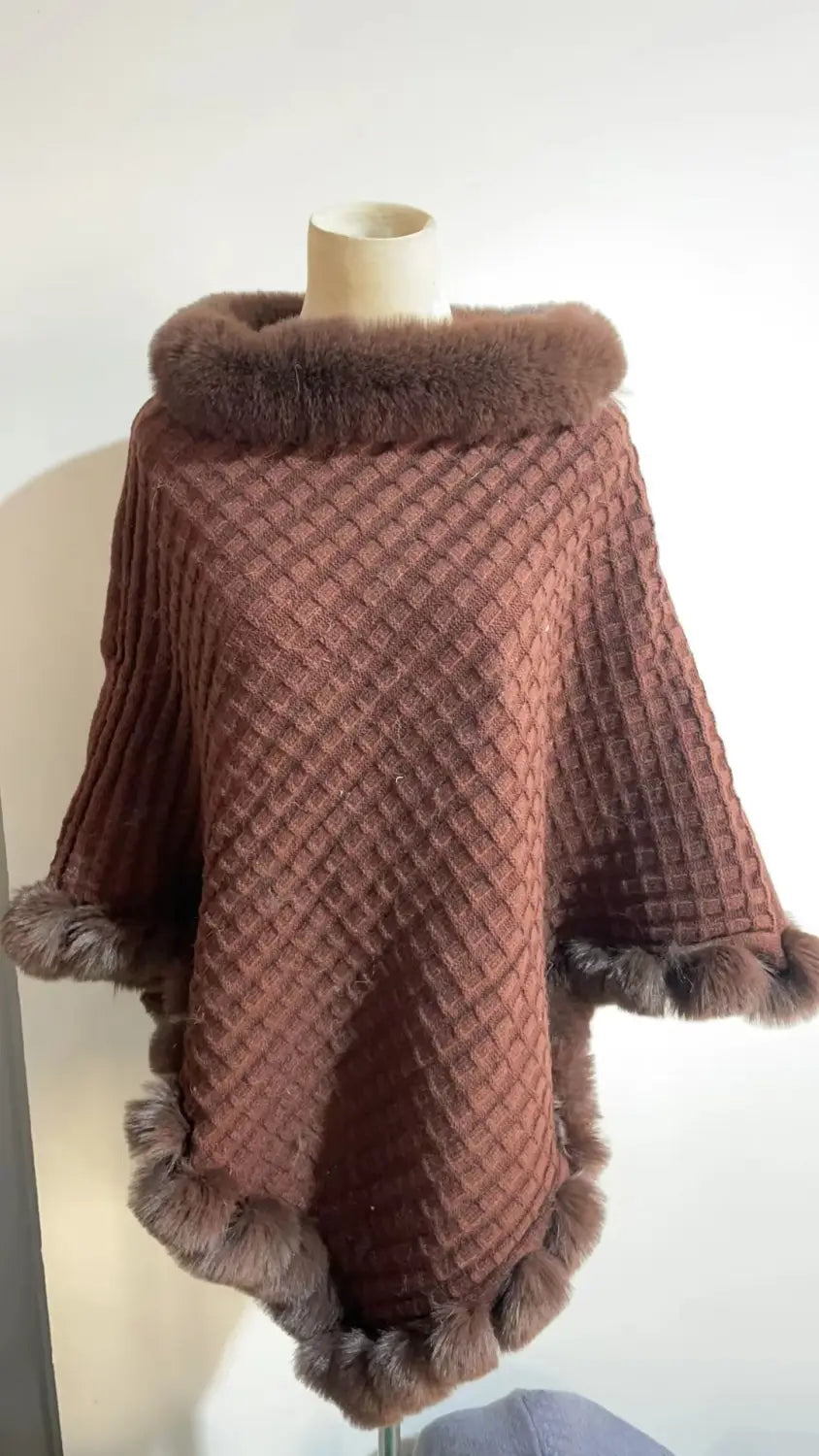 Mauve knitted poncho with brown fur collar, perfect for cozy style and luxury vibes.