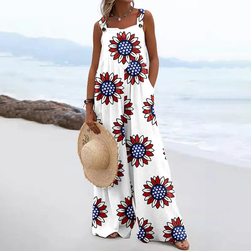 White maxi dress with red, white, and blue floral print square neck and straps.