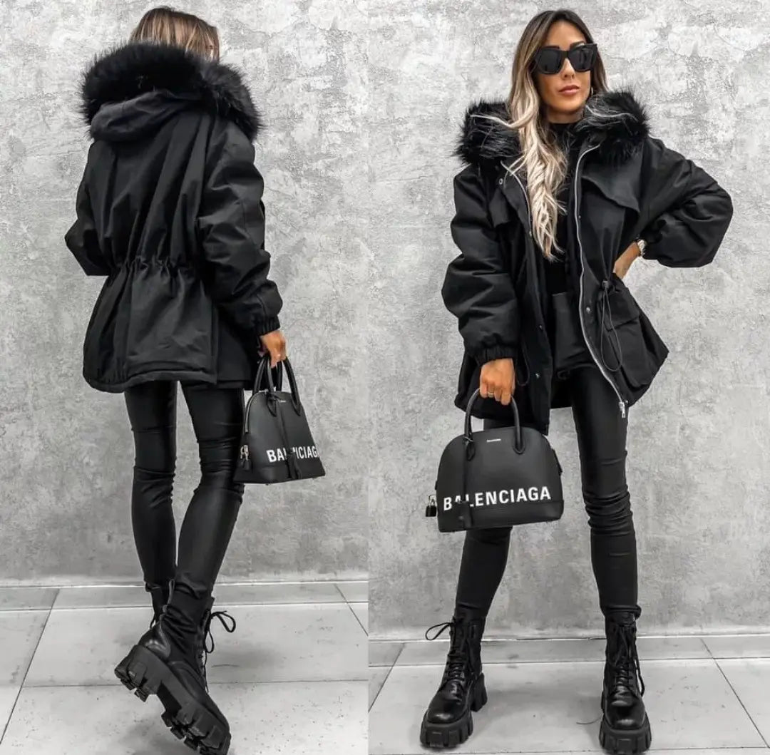 Black parka coat with faux fur collar, drawstring waist, and long sleeved zip style.