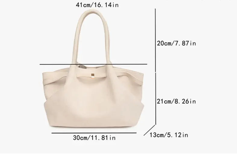 Sac fourre-tout élégant en daim avec une grande capacité impressionnante et des poignées confortables pour les femmes modernes.