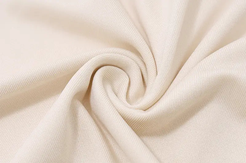 Twisted cream fabric showcasing the sexy slim fit pleated strapless dress texture.