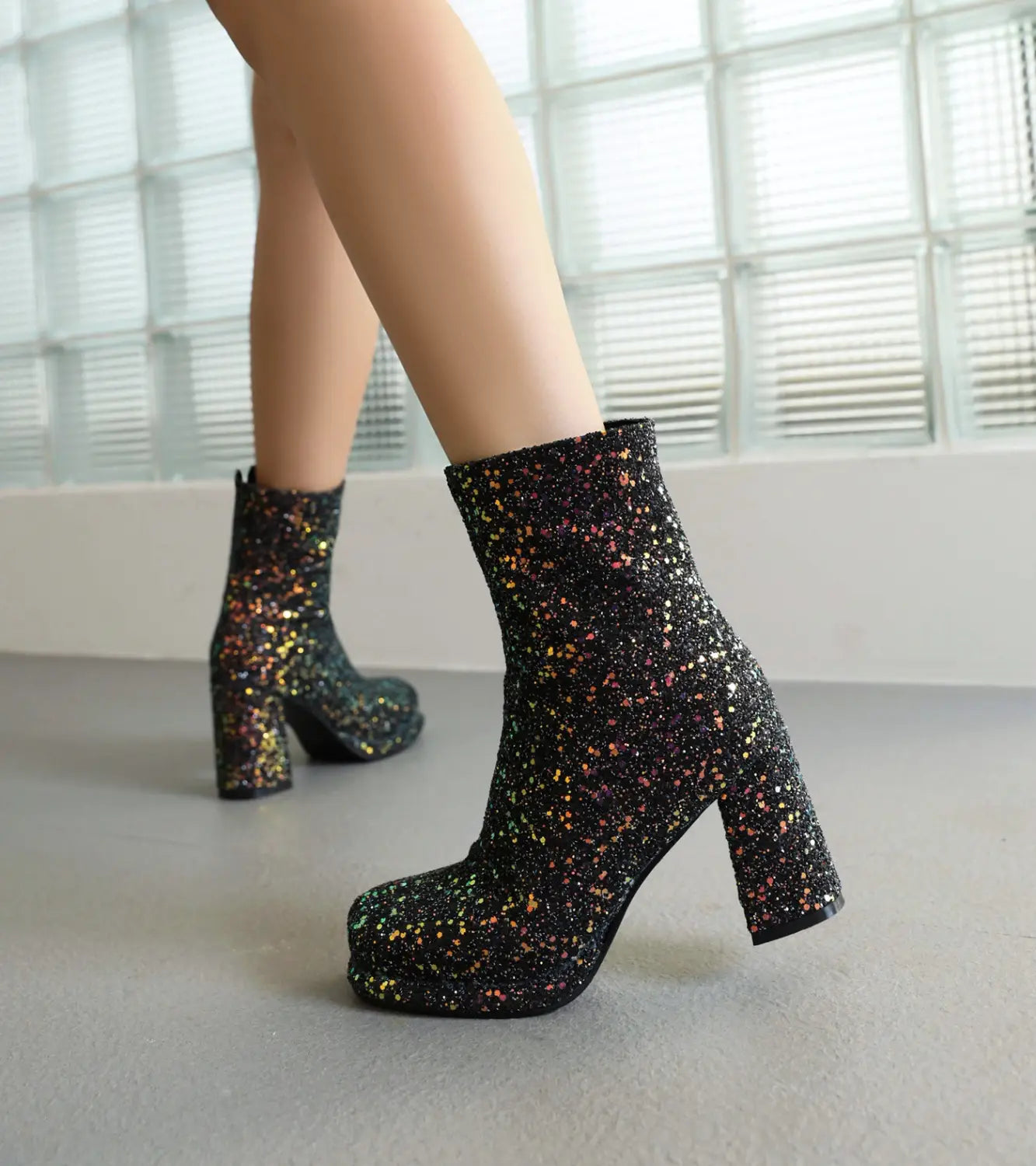 Sparkly black glitter thick high heel ankle boots perfect for Christmas style.