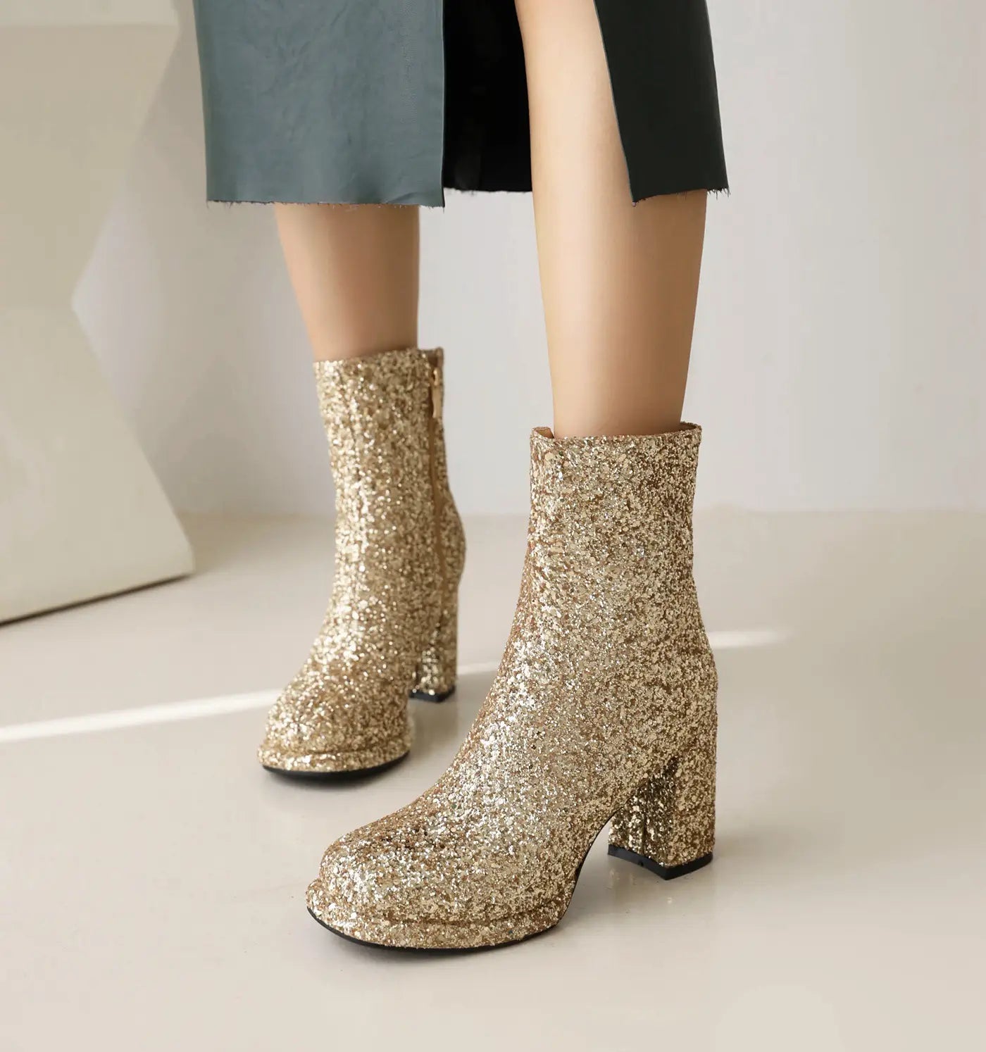 Ladies Glitter Thick High Heel Ankle Christmas Boots in Gold with chunky heels and sparkle.