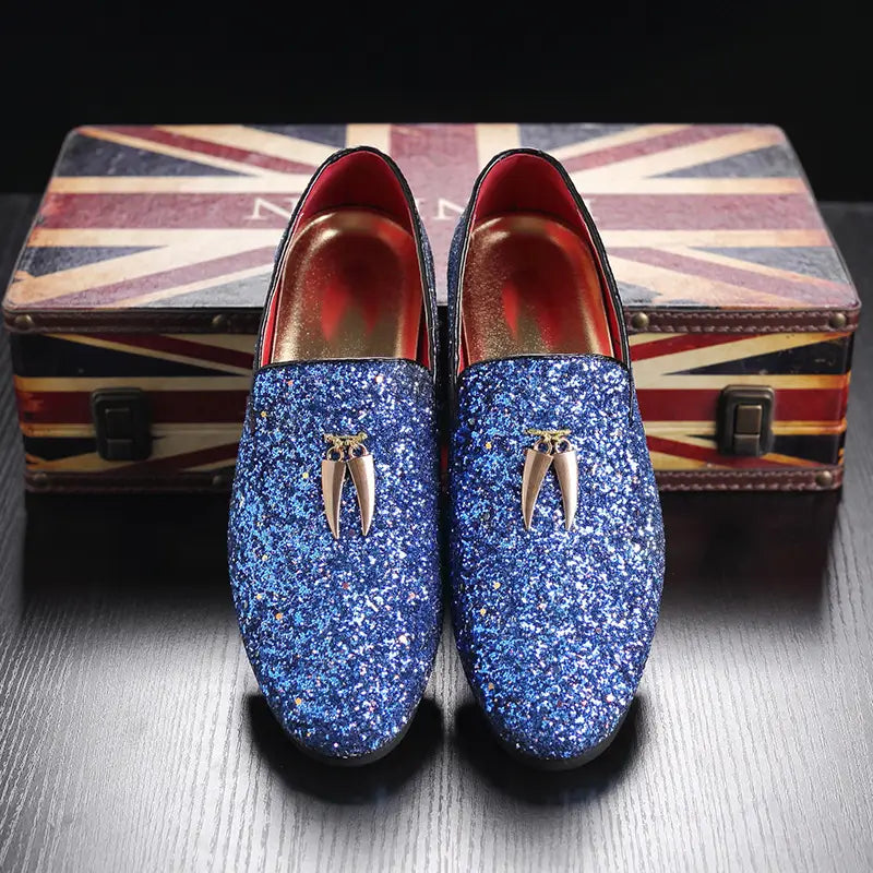 Sparkly blue casual glittered rhinestone loafers with metallic tassels for stylish fun.