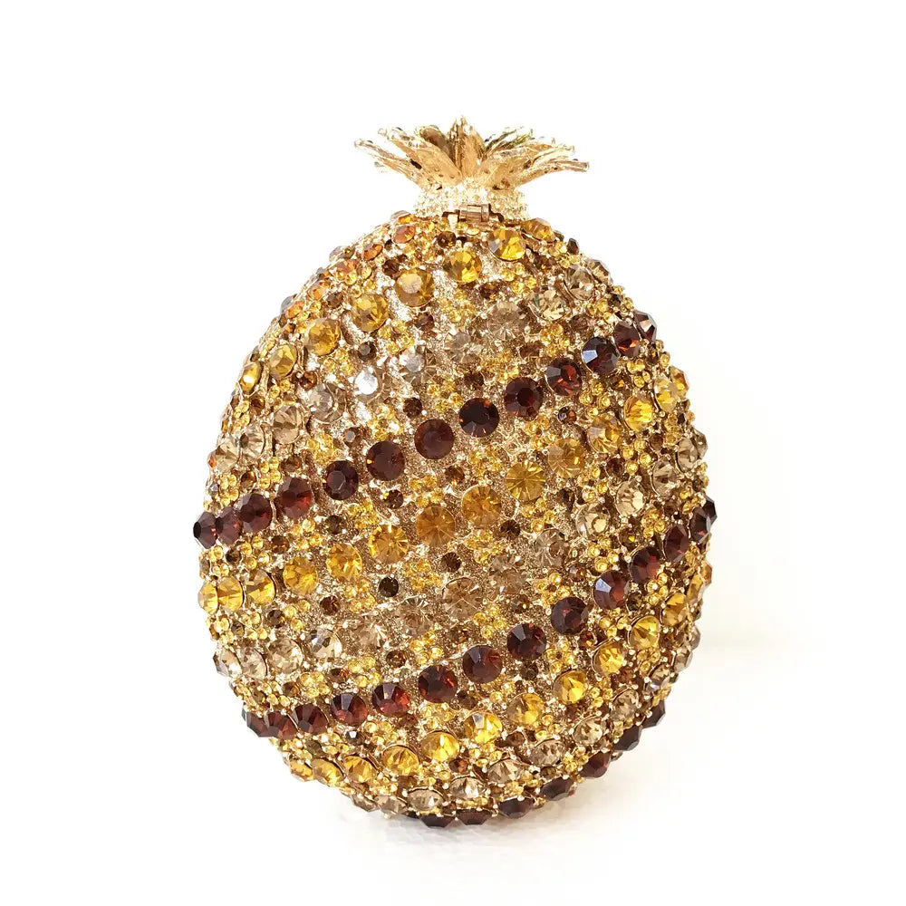 Decorative golden pineapple shaped crystal with amber crystals in a diamante banquet bag.