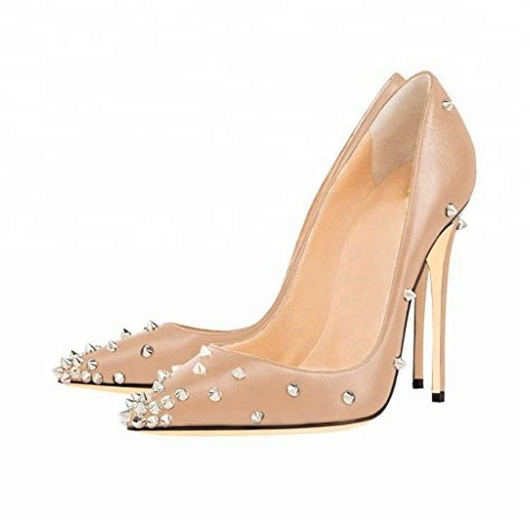 Nude patent leather pointed toe pumps with silver spikes for fashion-forward trendsetters.