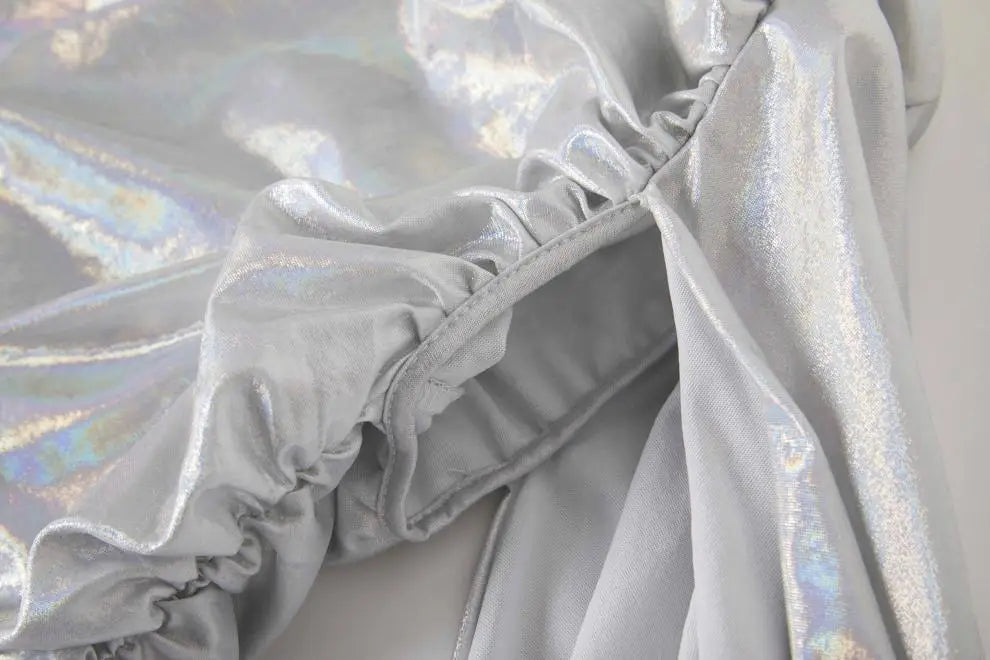 Shimmery silver-white fabric with an iridescent sheen for a sexy asymmetrical design dress.