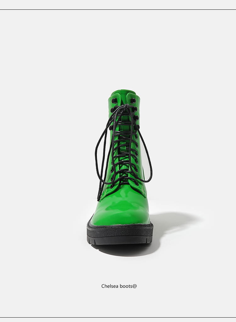 Bright green women’s patent thick sole winter Chelsea boots with black laces.