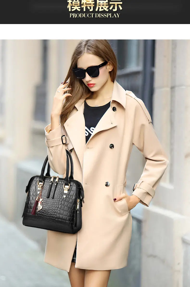 Beige double-breasted trench coat paired with ladies crocodile print crossbody shoulder bag.