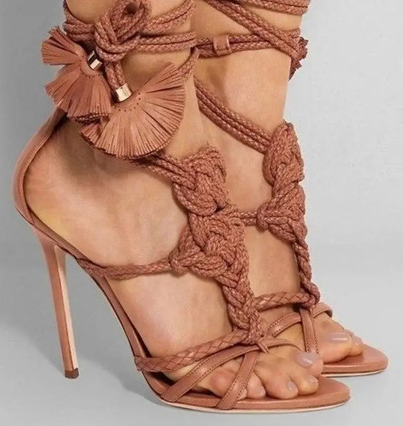 Dusty rose high heel sandals with braided straps and tassels for stylish comfort.