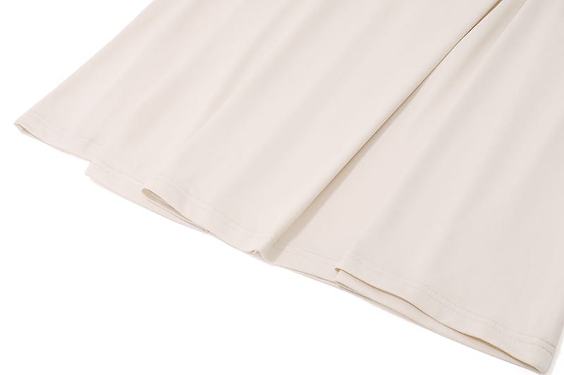 White vinyl siding panel with grooves alongside Off-the-shoulder Sexy Slim Fit Pleated Strapless Dress.